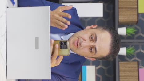 Vertical-video-of-Frustrated-businessman-is-upset.
